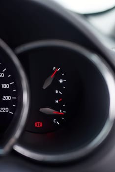 Car, dashboard and zoom of gauge of motor vehicle for petrol, temperature and speed limit for drive or journey. Auto, speedometer and interior of luxury automobile for reading of fuel consumption.