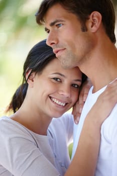 Couple, hug and outdoors together in portrait, love and affection in marriage or romance in nature. People, happy and smile in embrace for healthy relationship, commitment and relax on vacation.