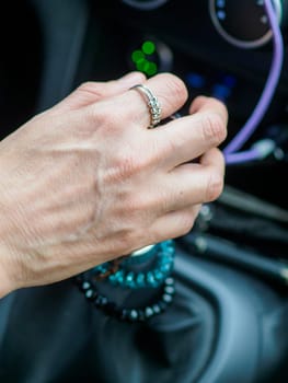 woman hand change manual gear while driving a car