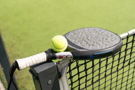 Paddle tennis racket and ball. High quality photo