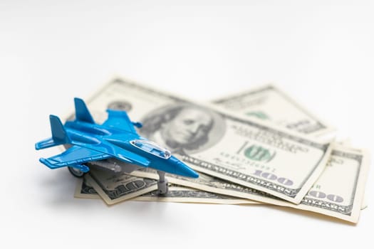 Toy plane and money on background. Travel insurance. High quality photo