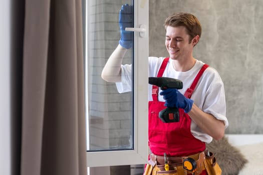 A repairman fixing windows in new apartment.