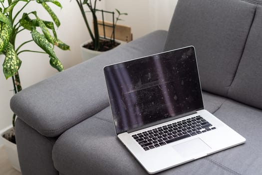 Laptop on white bed work at home concept. Background image. High quality photo