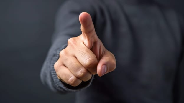 A man pointing at something with his finger