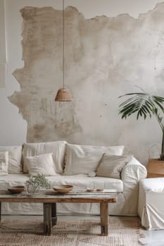 A living room with a couch, coffee table and potted plant
