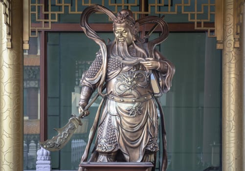 Bangkok, Thailand - Apr 11, 2024 - Statue of Sangharama Bodhisattva (Buddhist deity) or The Chinese general Guan Yu, the representation of a Sangharama deity at Fo Guang Shan Thaihua Temple, Mahayana buddhist taiwanese temple, Space for text, Selective focus.