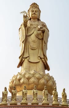 Bangkok, Thailand - Apr 11, 2024 - Big Golden statue goddess of Mercy Guanyin or Quan Yin statue at Fo Guang Shan Thaihua Temple. Guan Yin Buddha, Taiwanese temple style, Copy space, Selective focus.