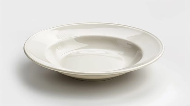 A white bowl on a table with no food in it