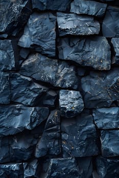 A detailed closeup of a stone wall made of bedrock grey rocks, with a cobblestone pattern and a few scattered automotive tires, contrasted against the electric blue sky