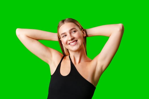 Blonde Woman in Black Tank Top Posing for Picture in studio