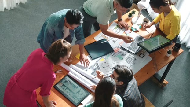 Time lapse of civil engineer team working together to plans building construction. Top view of architect designer walking and joining meeting while talking idea while looking at tablet. Symposium.