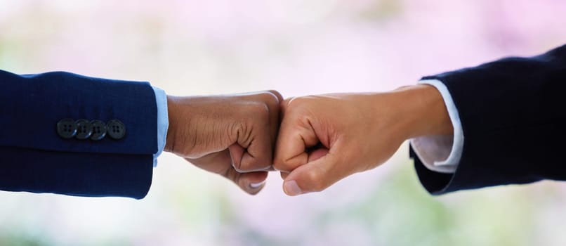 Hands, fist bump and business people in office with partnership, respect and agreement for teamwork. Employee, connection and synergy with collaboration, support and solidarity in corporate workplace.