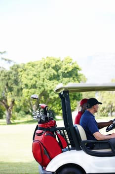 Friends, bag and driving golf cart on outdoor field for search of ball, club and male people for sport or fitness. Man, athlete and side view of vehicle for moving on green grass for exercise