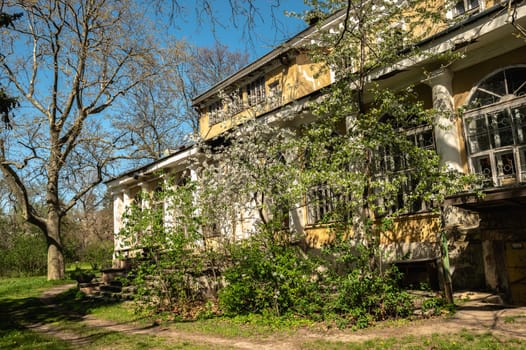 Odessa, Ukraine, 16.04.2024. Old historical building in Odessa Botanical Garden in Ukraine on a sunny spring day