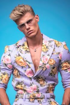 Stylish fashionable blond man wearing clothes from famous brands. High quality photo