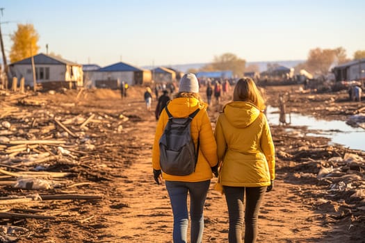 Girls go to a refugee camp. High quality photo