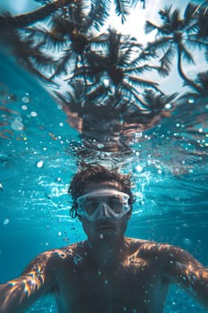 A Vertebrate Swimmer wearing headgear is having fun taking an underwater selfie in the azure waters of a swimming pool, enjoying leisure time in the aqua environment