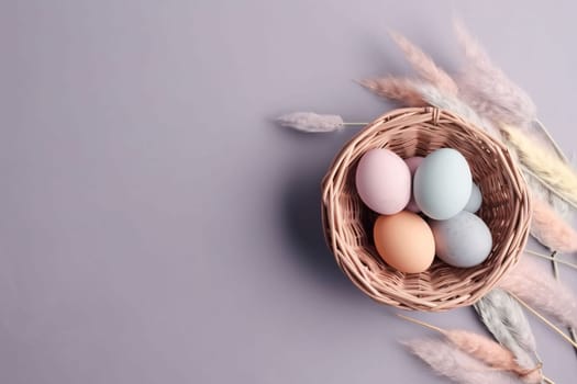 Banner: Easter eggs in a basket and dry grass on a gray background