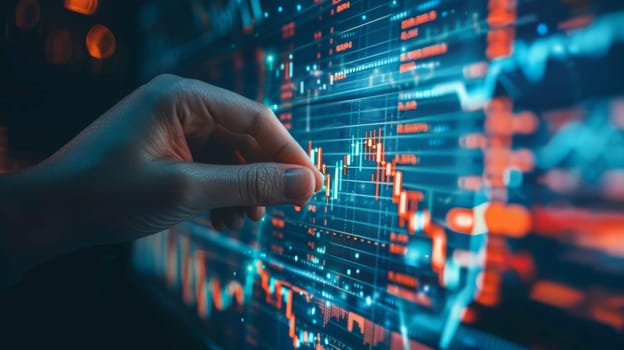 A person is pointing at a screen with stock prices