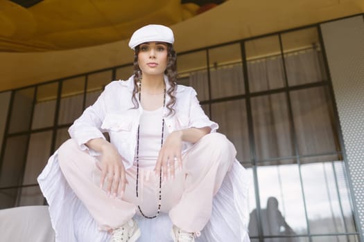 Beautiful sportive girl in stylish clothes in the underpass. Sport, dancing and urban culture concept