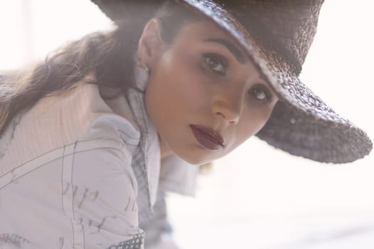 Indoor portrait of a young beautiful fashionable woman wearing stylish accessories. Female fashion, beauty and advertisement concept. Close up. Copy space for text.