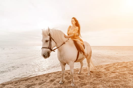 A white horse and a woman in a dress stand on a beach, with the sky and sea creating a picturesque backdrop for the scene