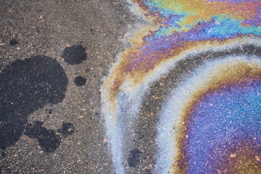 Stained Asphalt from Oil, Colorful Gasoline Fuel Marks on Road as Texture or Background