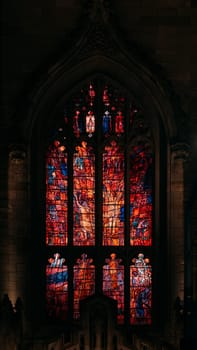 The stained glass masterpiece shines with stories in vibrant colors.