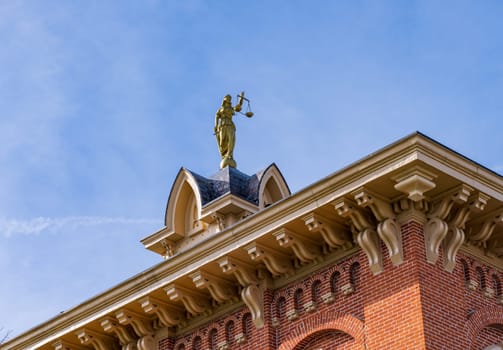 Lady Justice or Iustitia on the roof of the Delaware County Courthouse in Delaware, OH