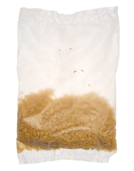 Raw bulgur grains in a cellophane transparent bag on an isolated background