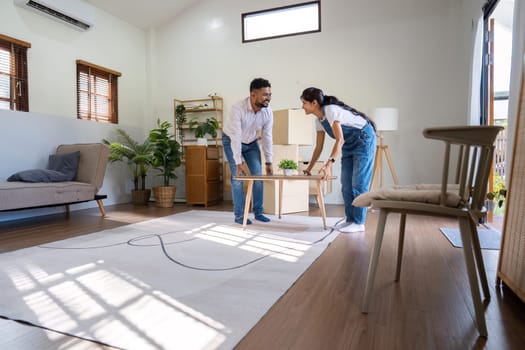 Married couple moving in new property bought together on mortgage loan.