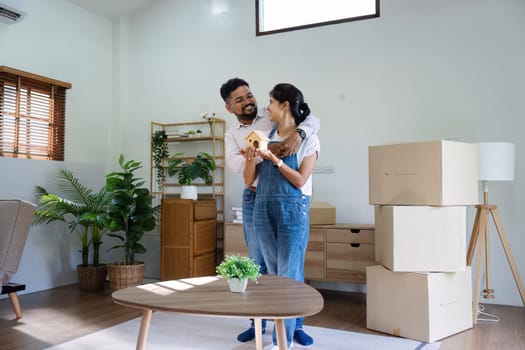 Married couple moving in new property bought together on mortgage loan.