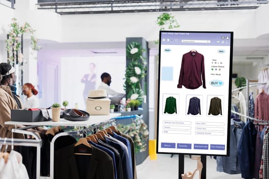 Touch screen monitor kiosk service, modern fashion collection and products on interactive board in mall store. Electronic self ordering display of online clothes shop, business concept.