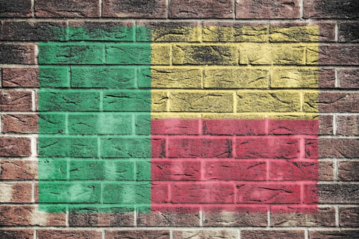 A Benin flag on a brick wall background