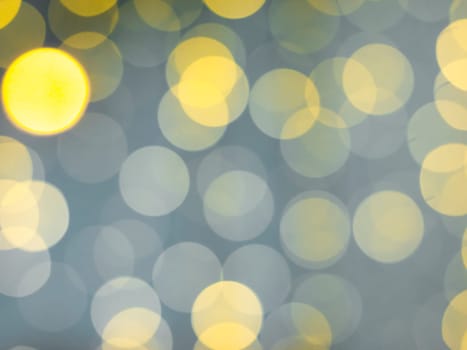 gold abstract background with bokeh defocused lights. Soft blurred yellow and gold bokeh background, Abstract lights. Defocusing lens