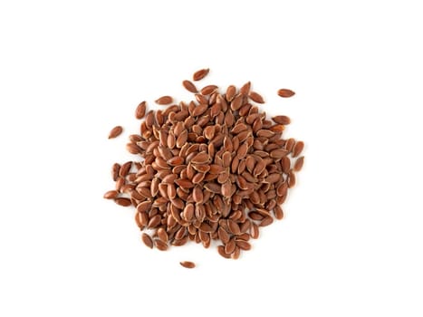 Close up of flax seeds isolated on white background. Linseed pile closeup isolated on white with clipping path. Top view or flat lay.