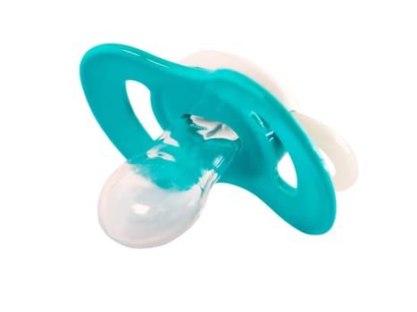 Blue baby silicone pacifier isolated on white. Blue soother or pacifier isolated on white with clipping path.