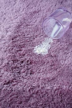spill milk on a carpet top view