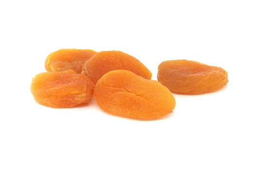 Pile dried apricots fruits isolated on white background