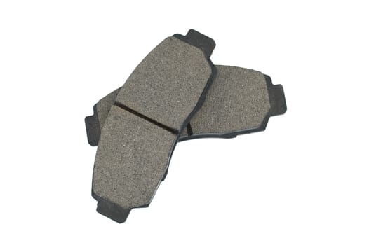 New disc brake pads isolated on white background, maintenance of the braking system