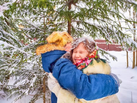 Two cute happy little cheerful children in winter snow forest. Photo shoot in stylized clothes of the USSR. Fur Hat with earflaps