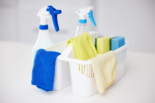 Cleaning, tools and basket with bottle spray for home disinfection or detergent container for janitor service. Chemical, cleaner or washing supplies with cloth and protection from bacteria or germs.