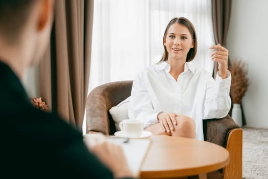 Psychological consultation gaining improvement on mental problem, happy young female patient doing therapy session while psychiatrist making diagnostic on mental illness. Unveiling