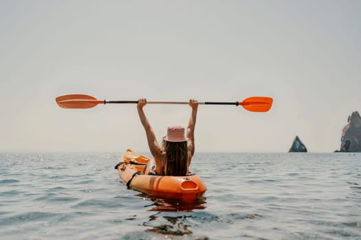 Kayak sea woman. Happy attractive woman with long hair in red swimsuit, swimming on kayak. Summer holiday vacation and travel concept