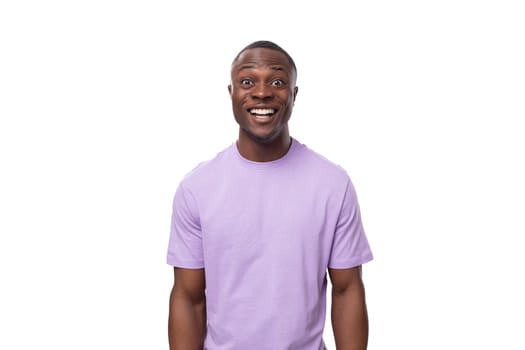 young adorable african man with short haircut wearing lilac t-shirt.
