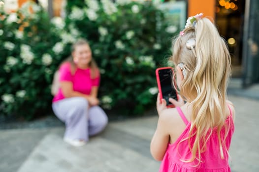 Funny baby with cochlear implant walks outdoor. Hearing aid and medicine innovating technology concept. Diversity and inclusion. Copy space.