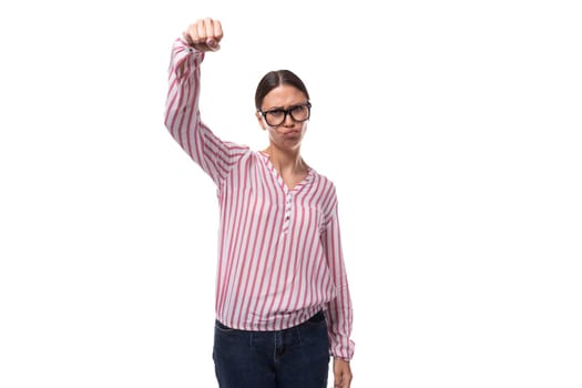 young positive secretary woman in glasses is dressed in a red-white blouse on a white background.