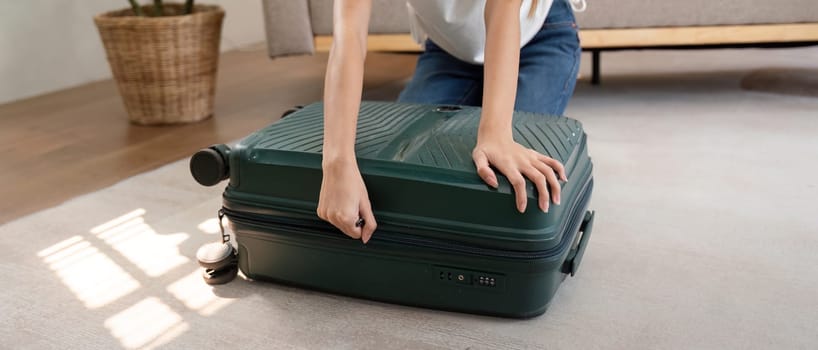Woman and suitcase for travel summertime vacation packing clothing. relax and getaway preparation.