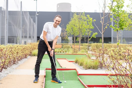 Minigolf player detail on green grass. High quality photo