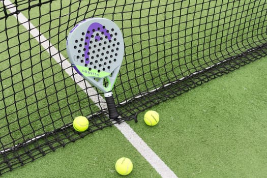 Ukraine Kyiv, April 13 2024. Paddle tennis racket and ball. High quality photo